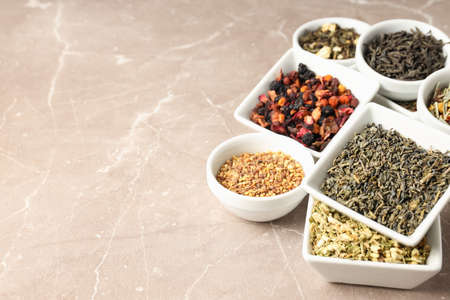 Concept of cooking tea with different types of tea on light textured backgroundの写真素材