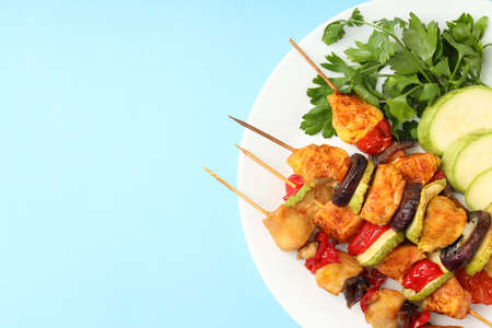 Concept of tasty food with chicken shashlik on blue backgroundの写真素材