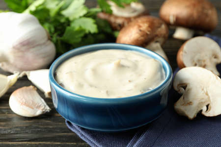 Concept of tasty food with mushroom sauce on wooden backgroundの写真素材