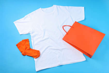 Blank t-shirt, bag and socks on blue backgroundの写真素材