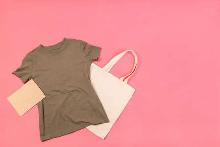 Blank t-shirt, bag and carton sheet on pink backgroundの写真素材