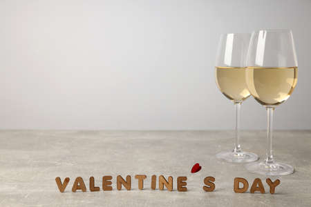Happy Valentine day composition on gray textured table