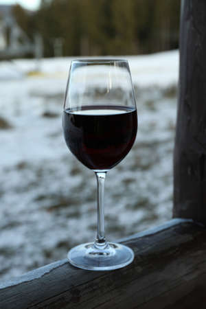 Glass of wine outdoor in winter dayの写真素材