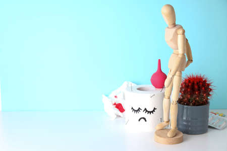 Concept of healthcare with hemorrhoids accessories on white table