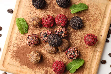 Concept of sweets with chocolate candies on white background