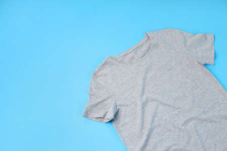 Blank gray t-shirt with space for print on blue backgroundの写真素材