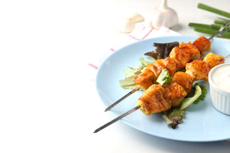 Concept of tasty food with chicken shashlik on white background