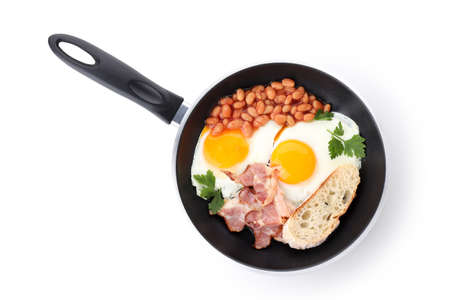 Pan with tasty breakfast isolated on white backgroundの写真素材