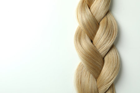 Light female hair on white background, close upの写真素材