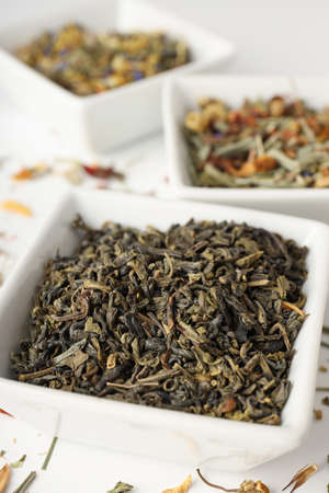 Concept of cooking tea with different types of tea on white backgroundの写真素材