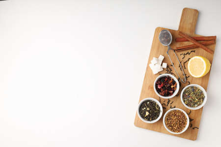 Concept of cooking tea with different types of tea on white backgroundの写真素材