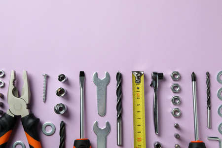 Work tools on purple background, top viewの写真素材