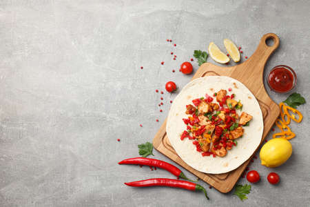 Concept of tasty food with taco on gray textured backgroundの写真素材