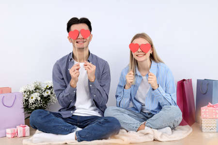Cute couple with heart isolated on white background