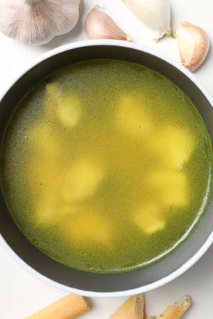 Concept of cooking chicken soup on white backgroundの写真素材
