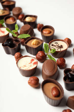 Flat lay composition with chocolate candies on white backgroundの写真素材