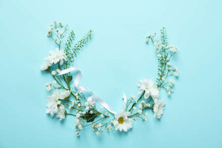 Hello spring concept with flowers on blue backgroundの写真素材