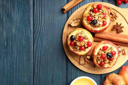 Concept of tasty food with baked apple on wooden backgroundの写真素材