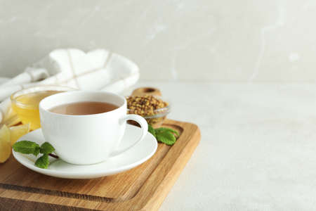 Concept of hot drink with buckwheat tea on light textured tableの写真素材