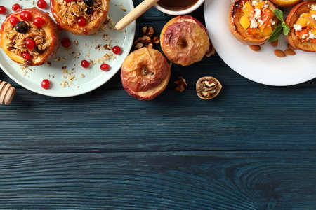 Concept of tasty food with baked apples on wooden tableの写真素材