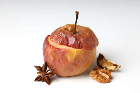 Concept of tasty food with baked apple on white backgroundの写真素材