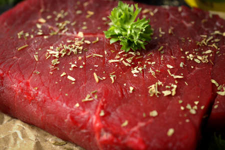 Concept of cooking with raw beef steak, close upの写真素材