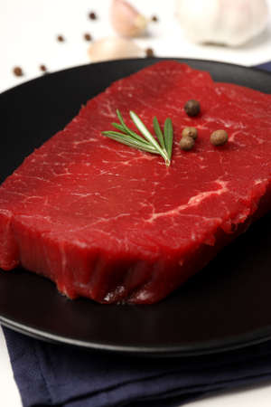 Concept of cooking with raw beef steak, close upの写真素材