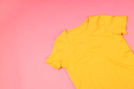 Yellow t-shirt with space for print on pink backgroundの写真素材