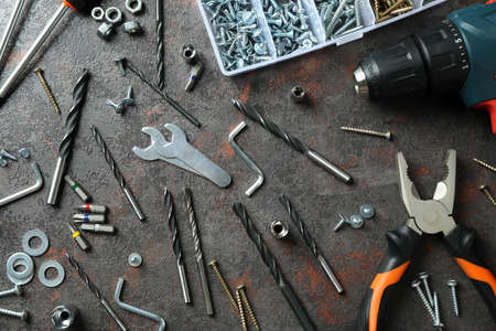 Work tools on dark textured background, top viewの写真素材