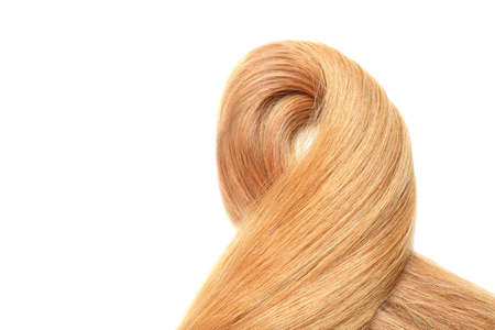 Lock of female hair isolated on white backgroundの写真素材