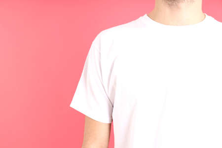 Man in blank white t-shirt on pink backgroundの写真素材