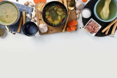 Concept of cooking chicken soup or broth on white background
