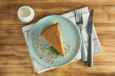 Concept of tasty dessert with honey cake, top view