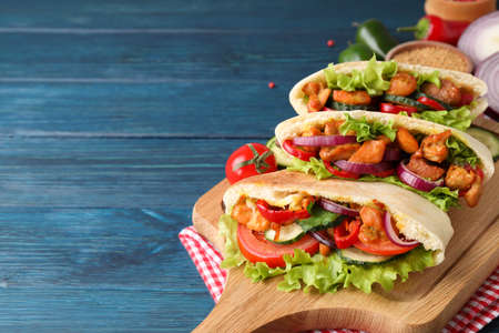 Concept of tasty food with pita with chicken, space for textの写真素材