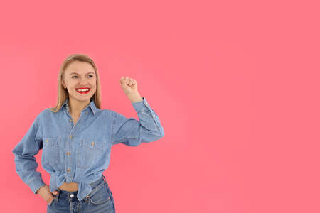 Girl power concept on pink background, space for text