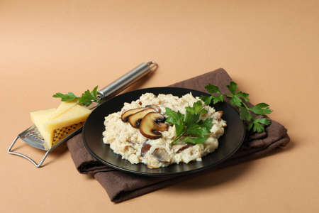 Concept of tasty food with risotto with mushrooms on beige backgroundの写真素材