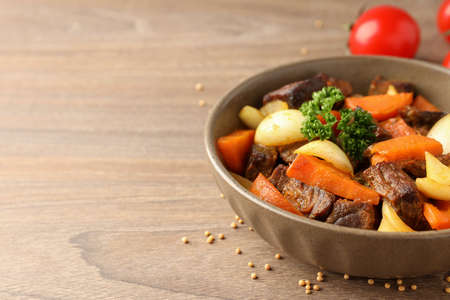 Concept of tasty food with beef with vegetables, space for textの写真素材