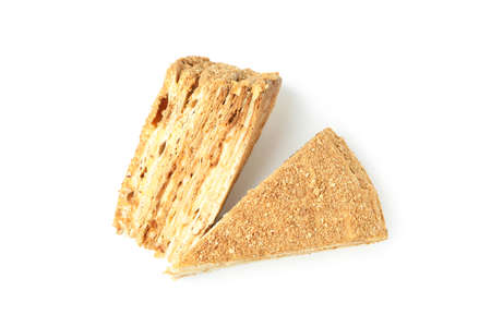 Pieces of honey cake isolated on white backgroundの写真素材