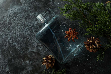 Composition with bottle of male perfume, close up