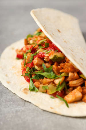Tasty taco on gray textured background, close upの写真素材