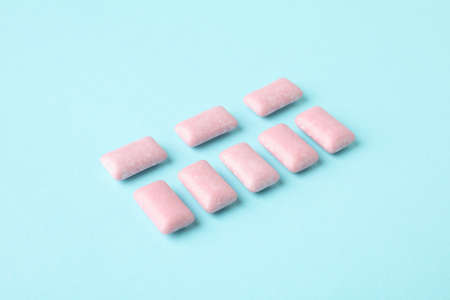Chewing or bubble gum on blue backgroundの写真素材