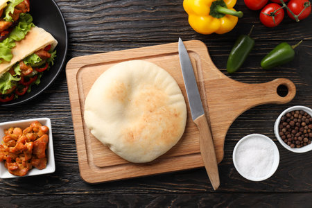 Concept of cooking pita on wooden background