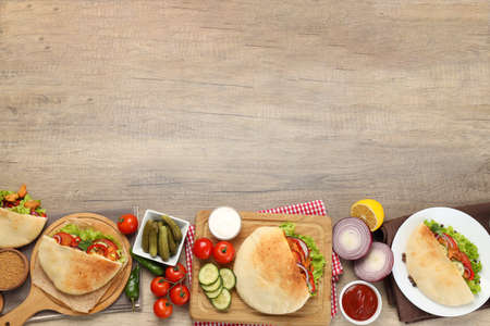 Concept of cooking pita with chicken on wooden background