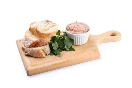 Board with baguette slices, pate and parsley isolated on white backgroundの写真素材
