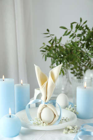 Concept of Easter table setting with candlesの写真素材