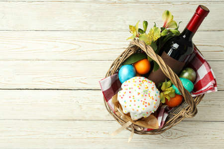 Concept of Easter food on white wooden table
