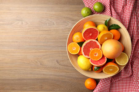 Concept of tasty food with citrus fruits on wooden backgroundの写真素材