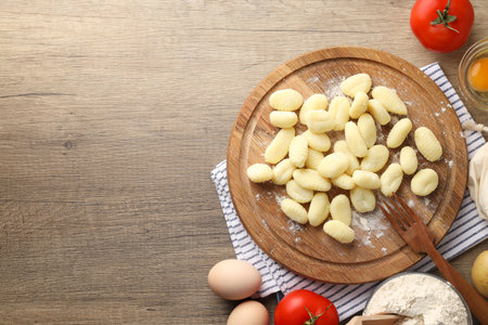 Concept of cooking with raw potato gnocchi, space for textの写真素材