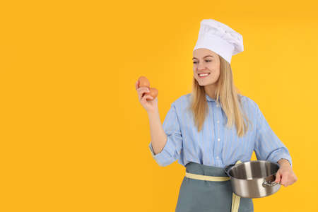 Concept of cooking with young woman, space for text
