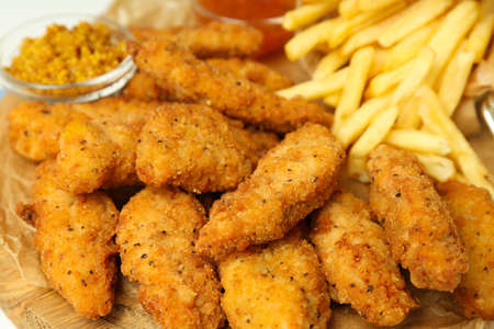 Concept of tasty food with Chicken strips, close upの写真素材